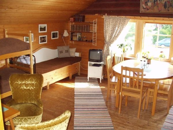Rönnegård,  &copy; Rönnegård, Room with a bunk bed, sofa and a table with chairs. 