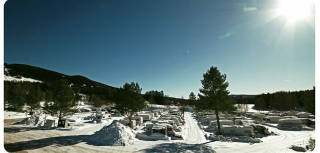 The camping area covered in snow.
