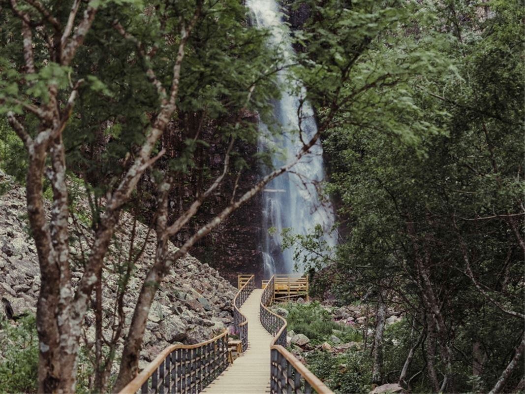 Bridge to a waterfall.