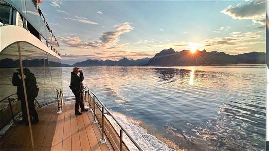 A guest looking at the midnight sun