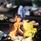 Majskolvar som lagar mat över en eld.