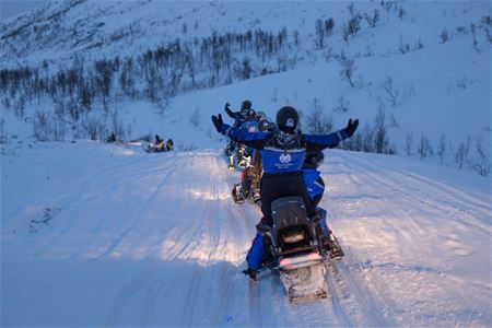 Snow scooter drivers enjoying themselves at Camp Tamok