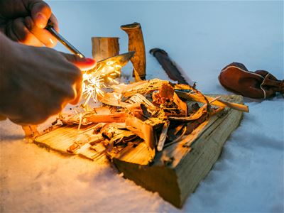 Lighting the fire with flint and steel