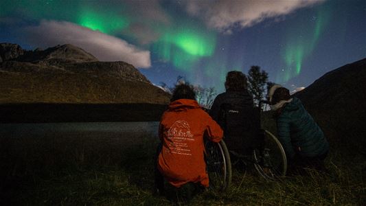 Three guest enjoying the northern lights
